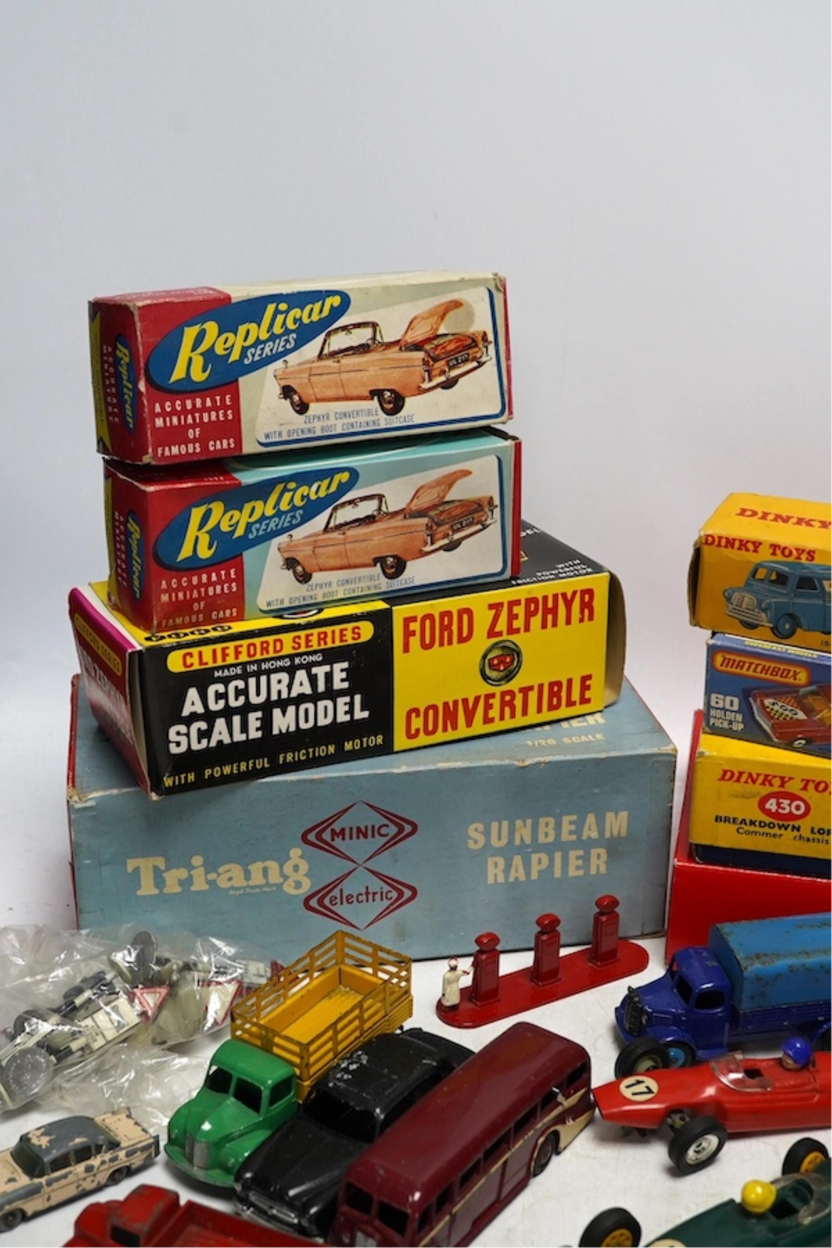 A quantity of diecast vehicles and a few useful boxes including; a boxed Clifford Series Ford Zephyr convertible, two boxed Replicar series Ford Zephyr convertibles, ten unboxed Dinky Toys, two Scalextric Formula One car